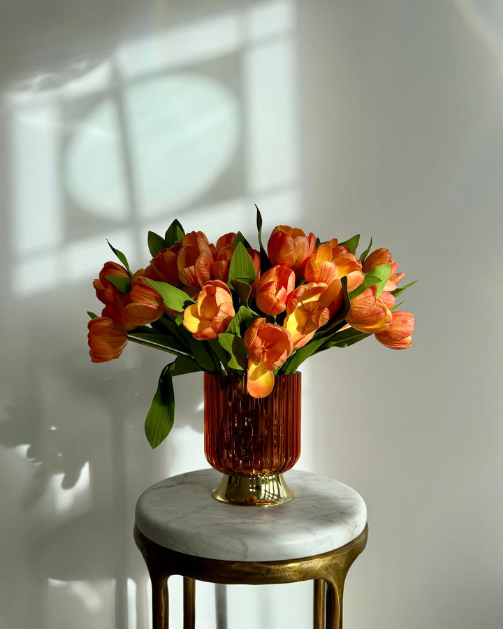 Tulips in orange with orange vase