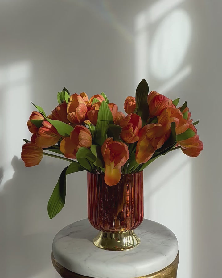 Tulips in orange with orange vase